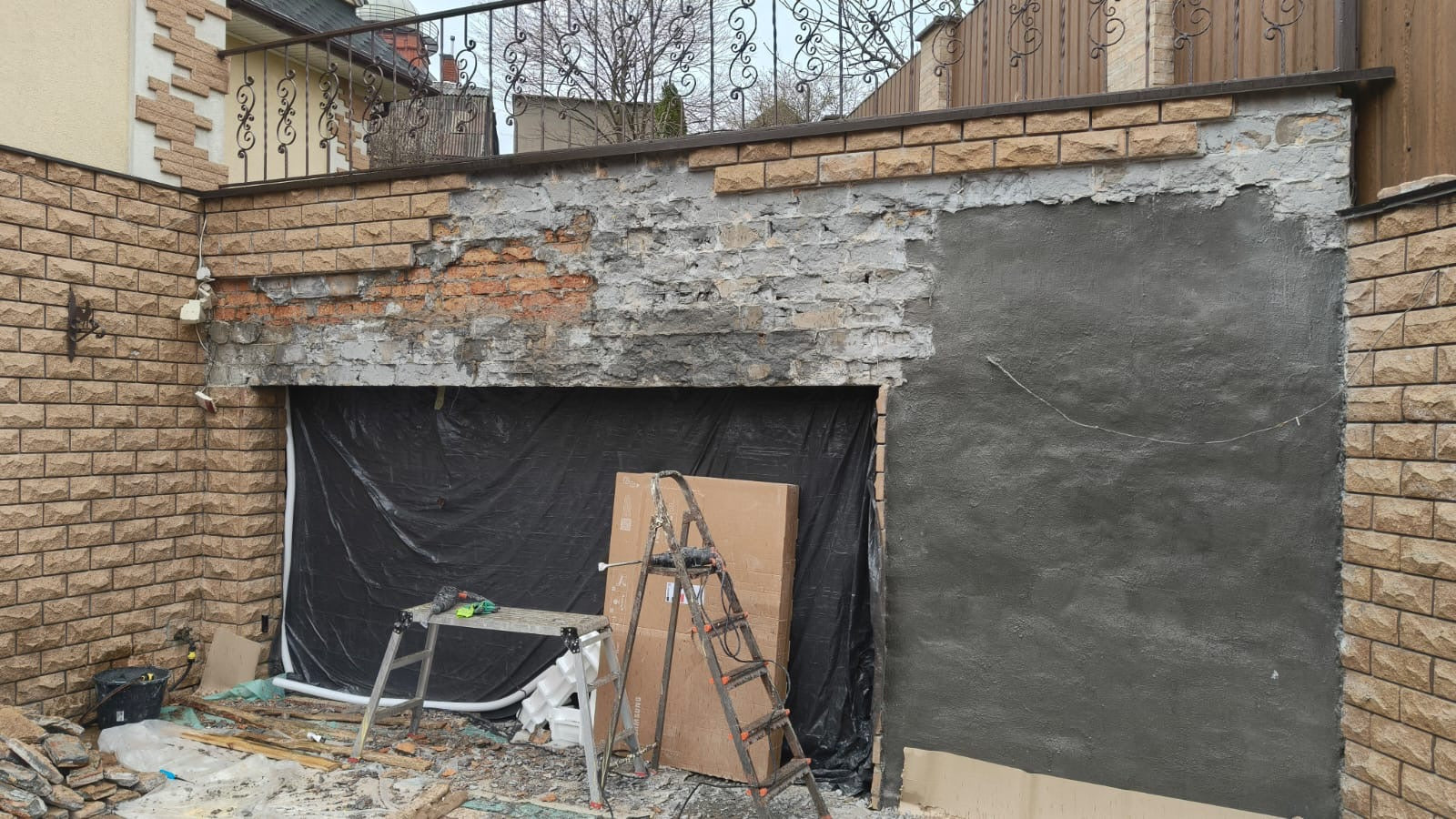 Before: damaged crumbling concrete wall needing repair